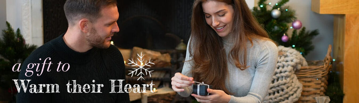 A couple sharing an EverWith jewellery gift at Christmas. A gift to warm their heart.